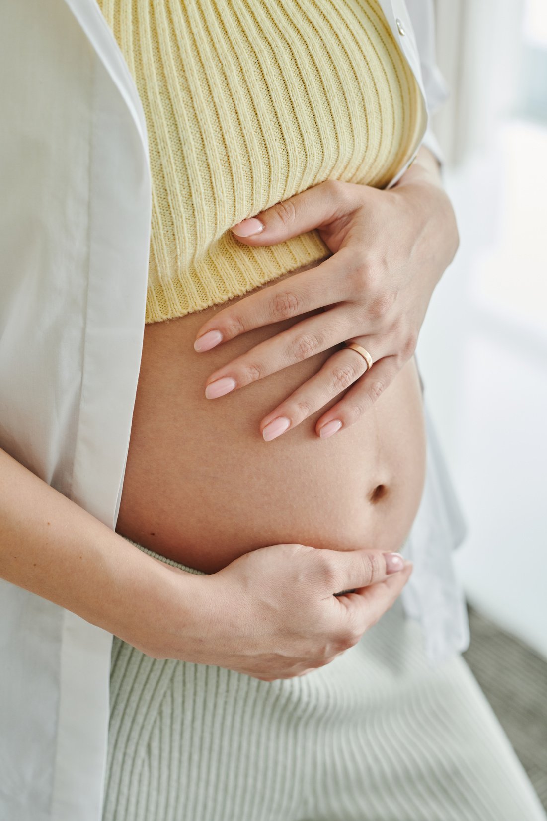 Pregnant Woman Holding Her Baby Bump